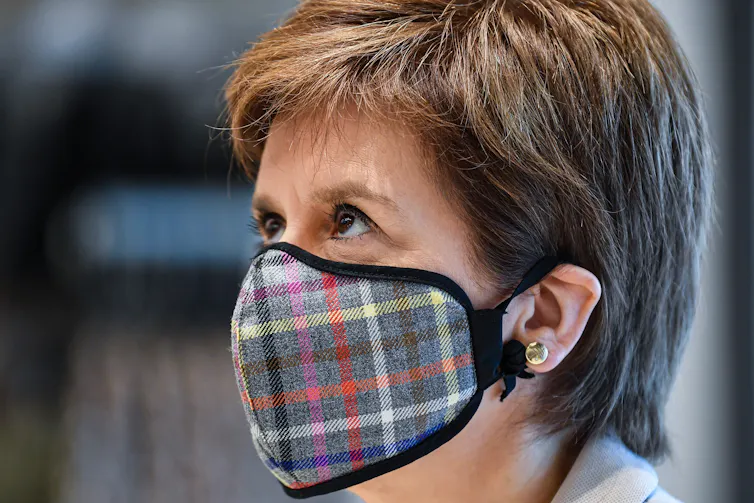 Nicola Sturgeon wearing a tartan mask.