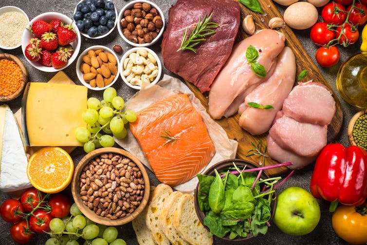 diabetes remission: An assortment of healthy foods, including salmon, berries, cheese, and legumes.