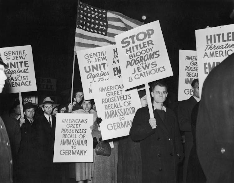 A demonstration near the German ocean liner SS Bremen in New York, after Hugh Wilson, the American ambassador to Germany was recalled in the wake of Kristallnacht.