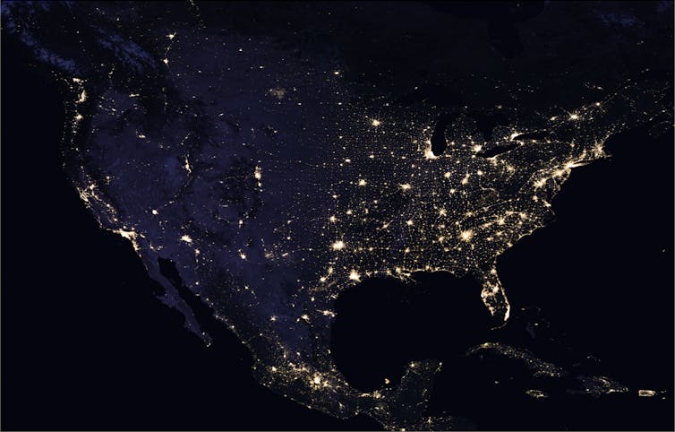 Satellite image of U.S. at night with cities brightly lit