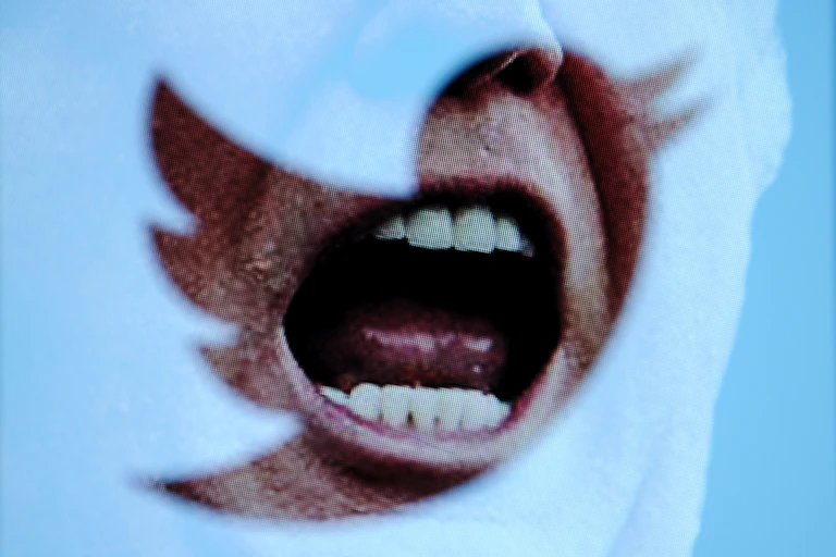 A close-up of Donald Trump's open mouth.