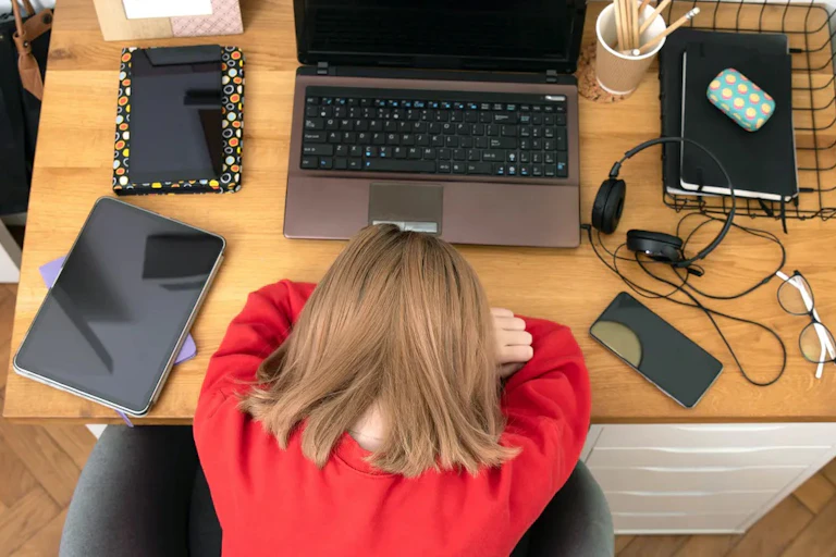 Woman with her head down.