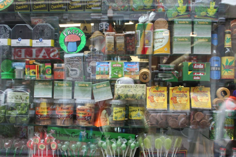 A store window with colourful cannabis packaging on display.