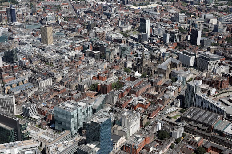 Aerial shot of city buildings showing lack of green space.