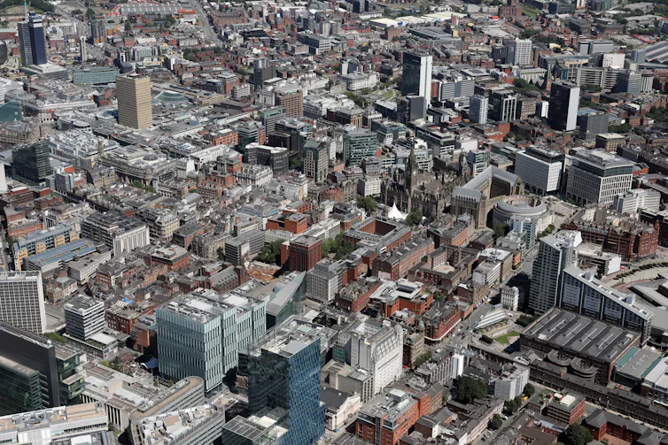 Aerial shot of city buildings showing lack of green space.