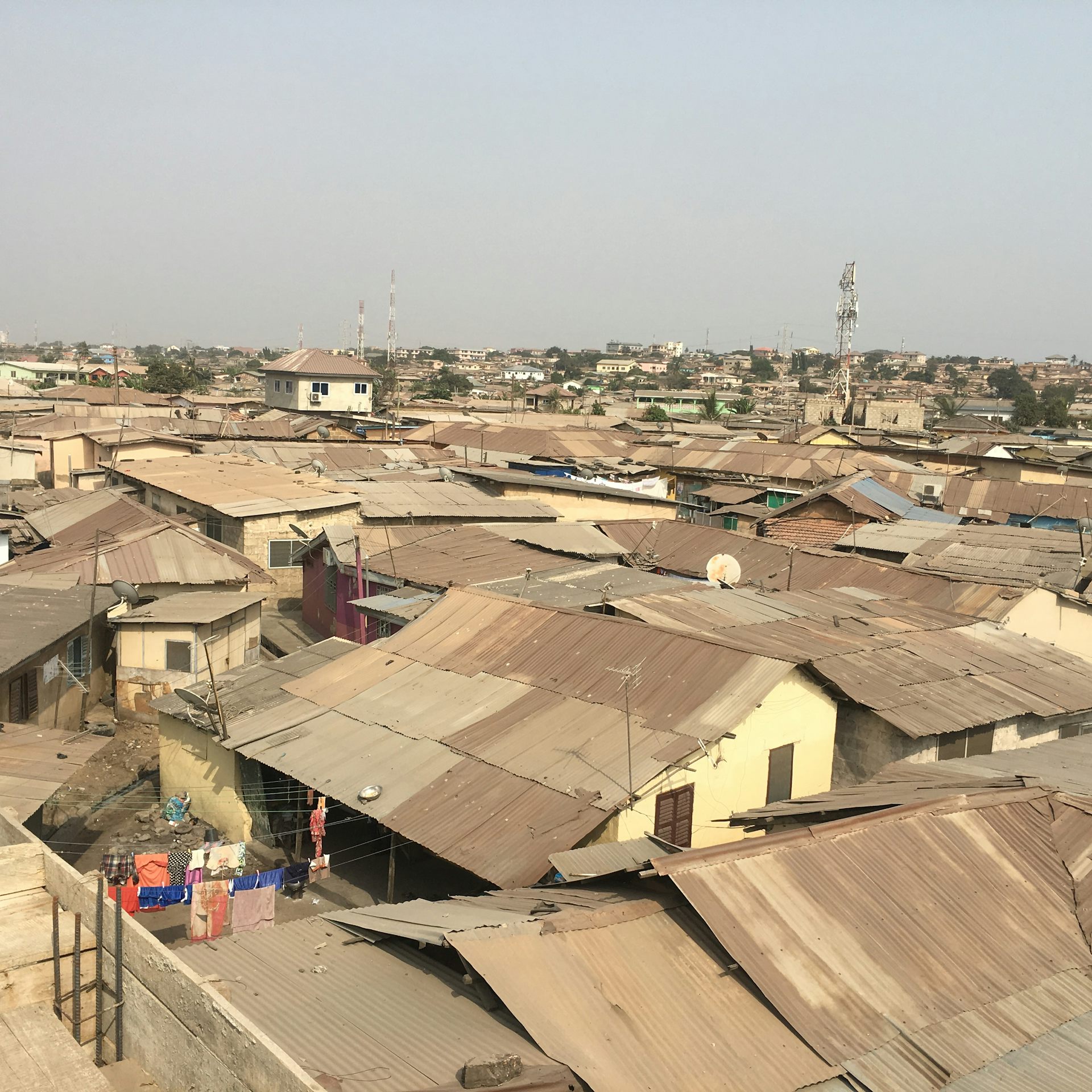 A view of metal rooftops in an urban community in Ghana.