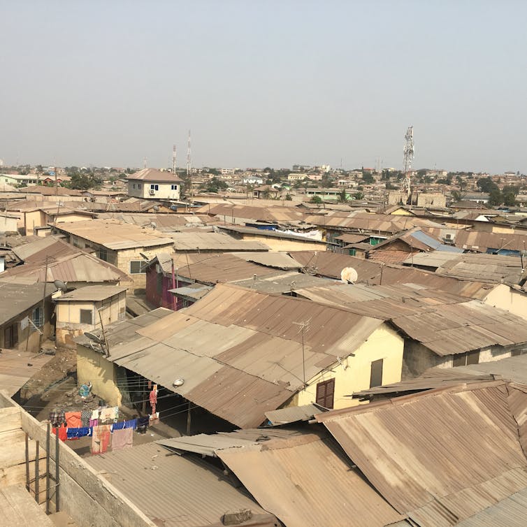A view of metal rooftops in an urban community in Ghana.
