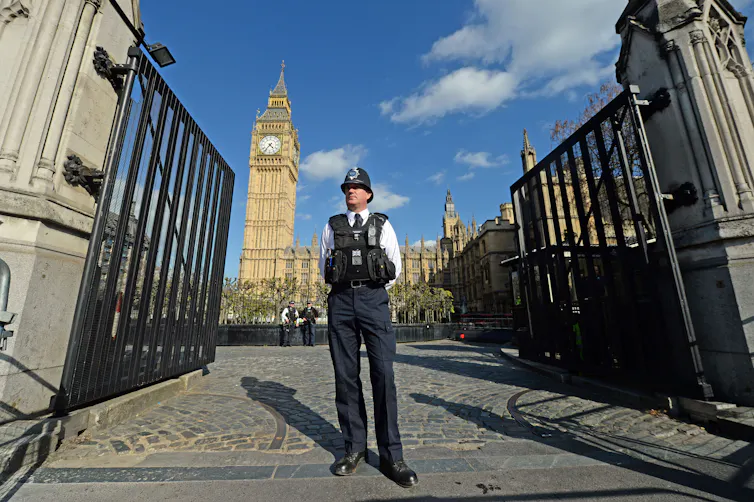 A policeman in front of the Houses of Parliament