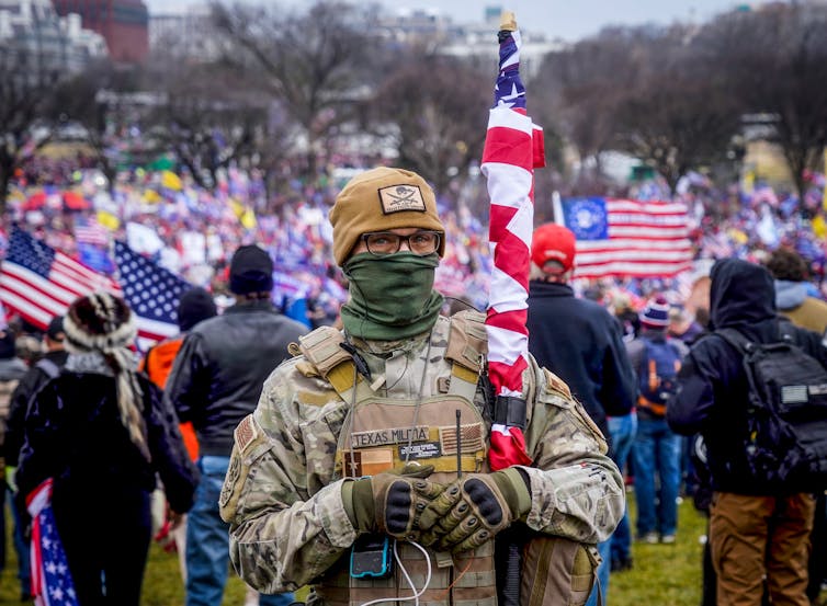 Police, soldiers bring lethal skill to militia campaigns against US government