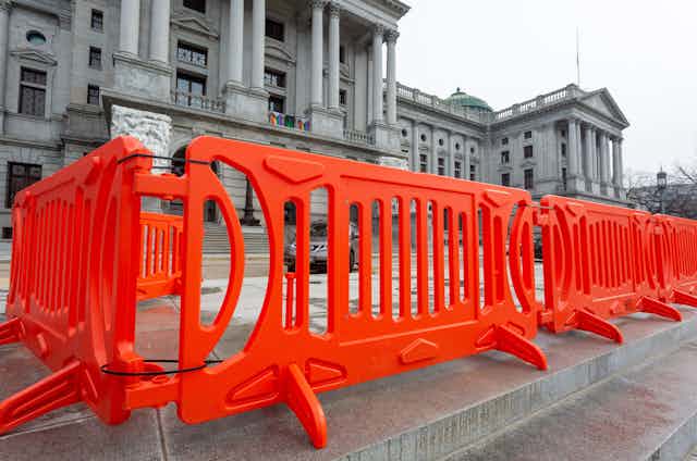 Orange barricades outside a government building