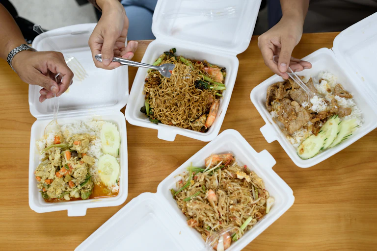 meal being eaten from single-use packaging