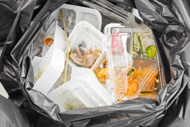 Food packaging waste in a bin