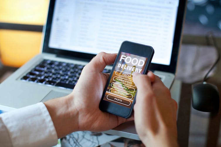 A man orders food via a smartphone app