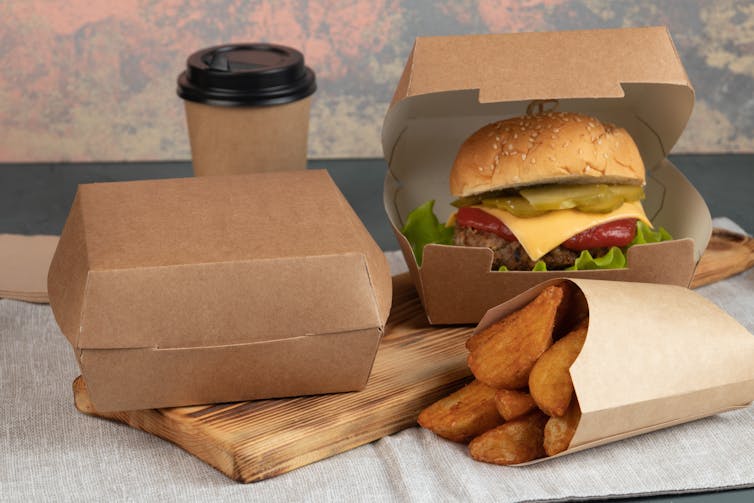 A burger meal in paper packaging
