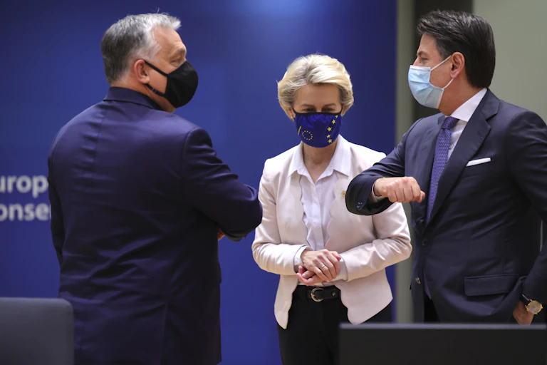 Hungary's Viktor Orban greets Italian prime minister Giuseppe Conte as Commission president Ursula von der Leyen looks on