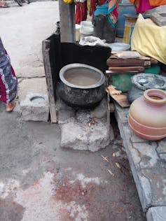 Picture of a pot on an open stove.