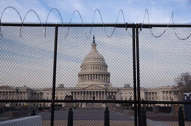 US Capitol building behind wire fences