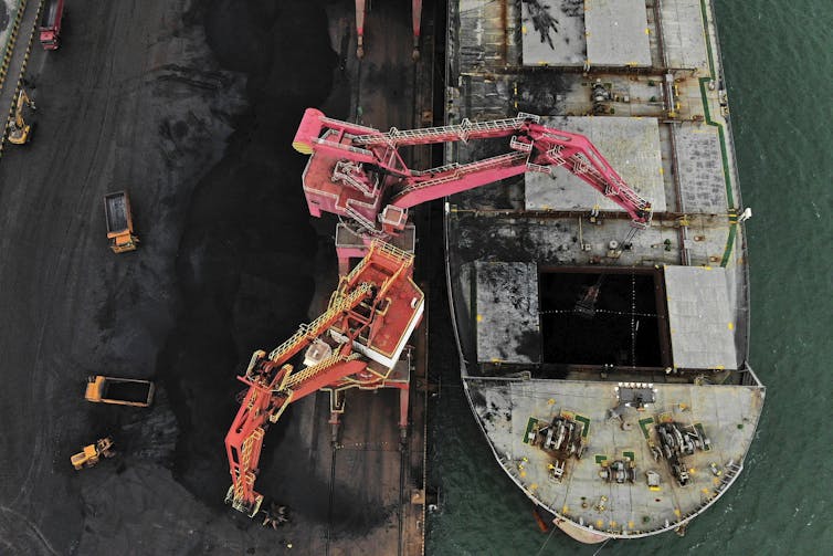 Coal ship unloads at Chinese port