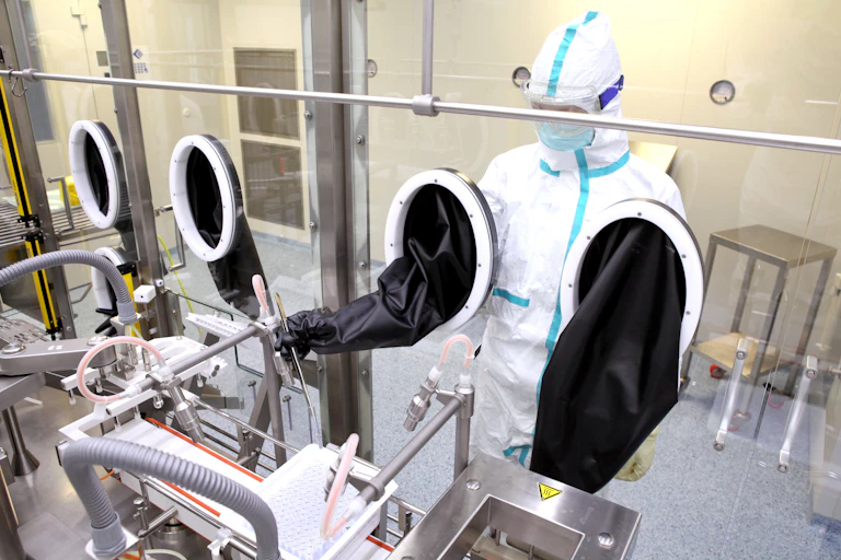 A virologist examines a vaccine against the virus.