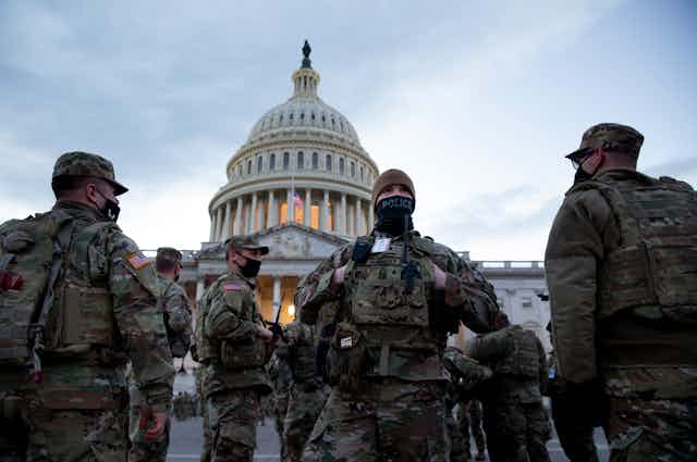 US military personnel guard the Capitol Building in Washington