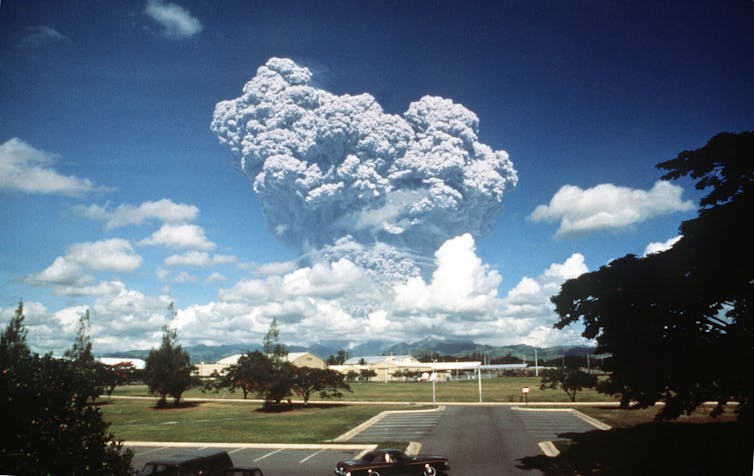 A large volcanic eruption cloud seen from afar.