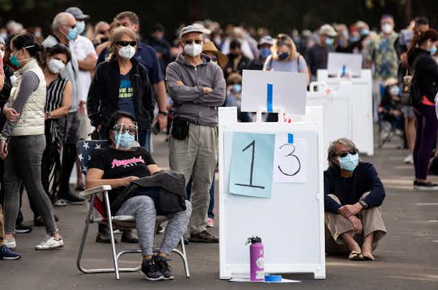 People queuing up to get vaccinated in California. 