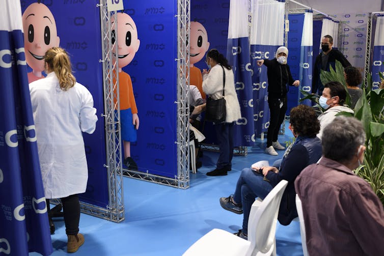 People waiting to be vaccinated in Israel