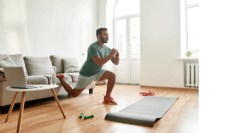 A man doing exercises in his living room