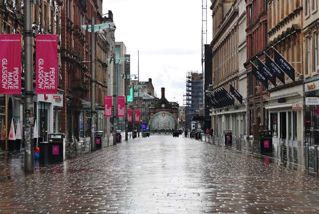 A wet and empty Buchanan Street in Glasgow during lockdown.