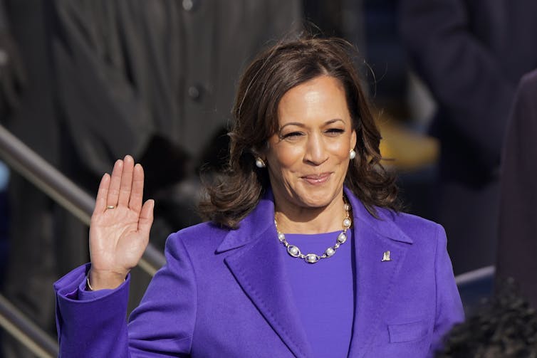 Kamala Harris raises her right hand while being sworn in as Vice President.