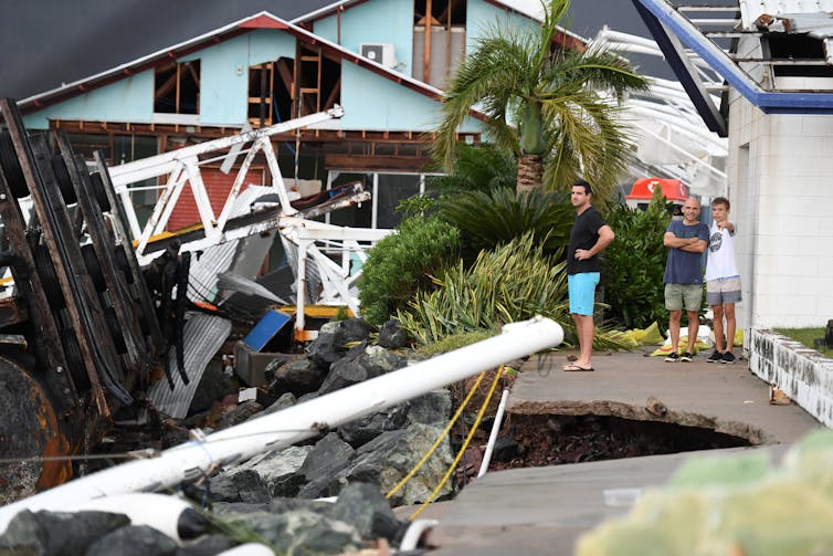 People inspect cyclone damage