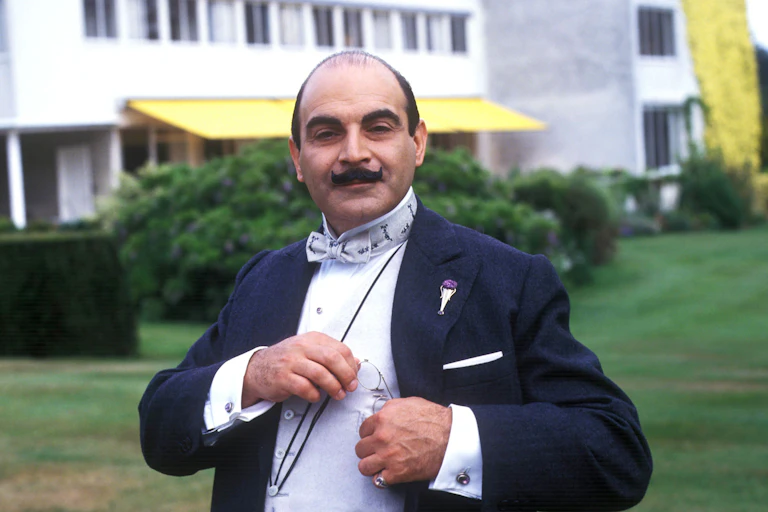 Man with moustache in suit.
