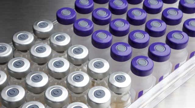 Vials of two different types of vaccine, side by side