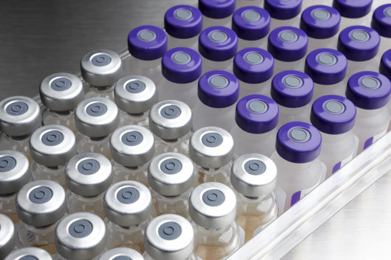 Vials of two different types of vaccine, side by side