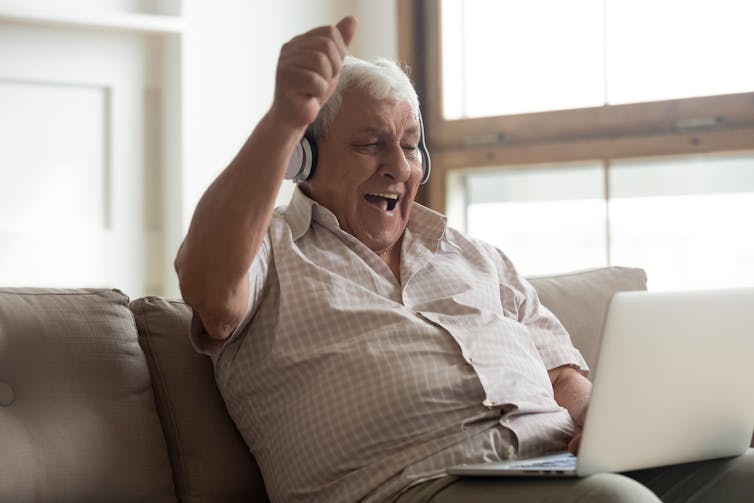 A man sitting on a couch on a videocall