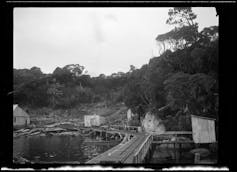 Whalers' shacks and rail tracks on a coast