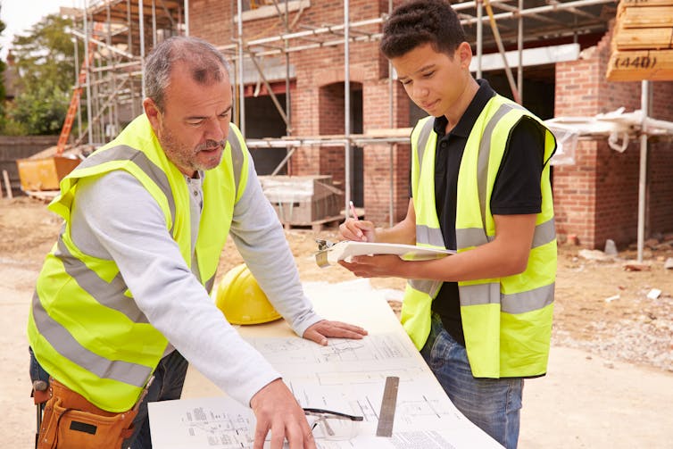 An apprentice talks with his mentor