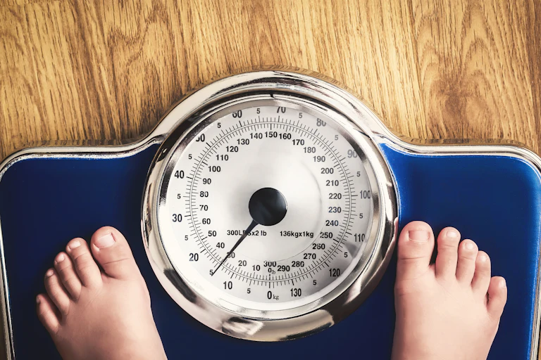 Person standing on scale.