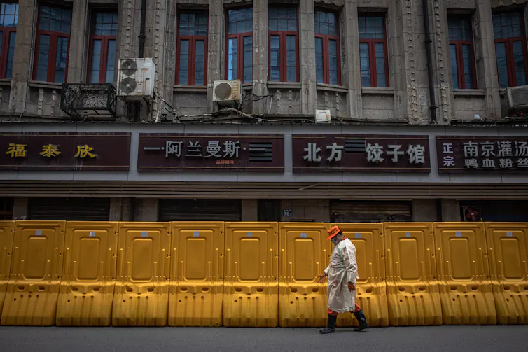 A fence between neighbourhoods in Wuhan during its first lockdown.