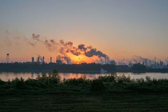 Smoke rises from chemical plants along the Mississippi River