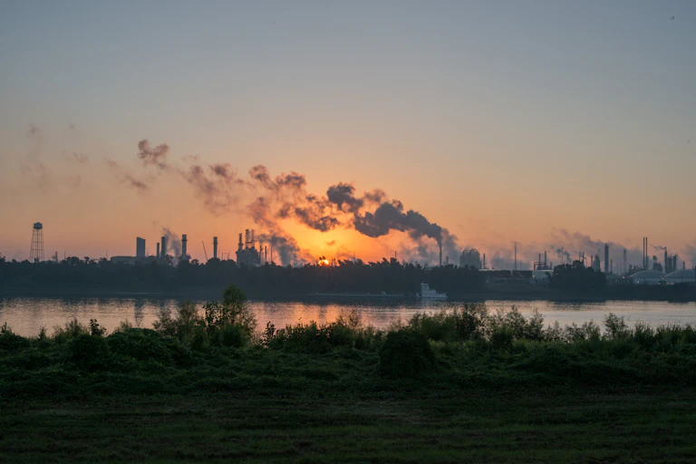 Smoke rises from chemical plants along the Mississippi River