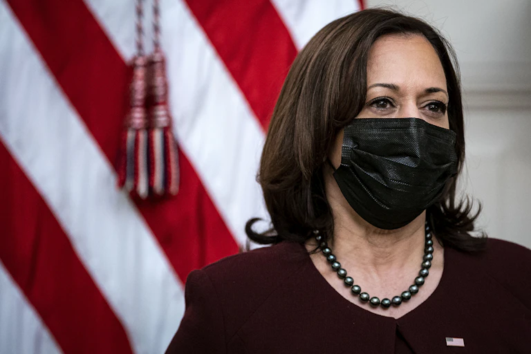 Vice President Kamala Harris wearing face mask in front of US flag