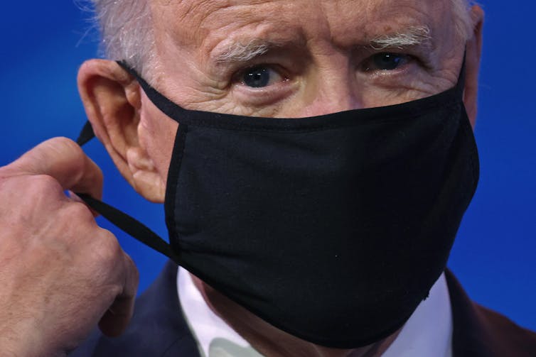 President Joe Biden, wearing a mask.