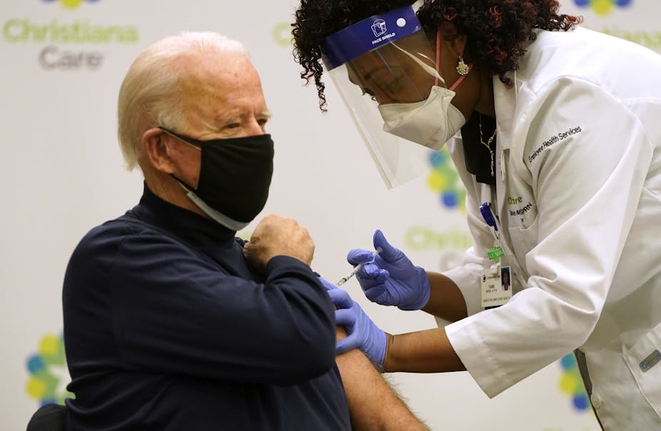 Biden receiving his COVID-19 vaccination shot.
