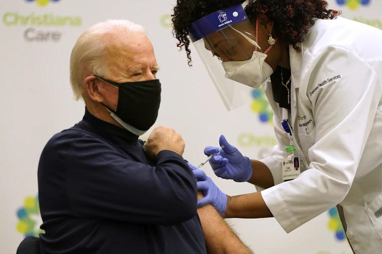 Biden receiving his COVID-19 vaccination shot.