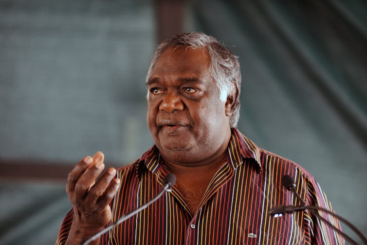 Man speaking at lectern