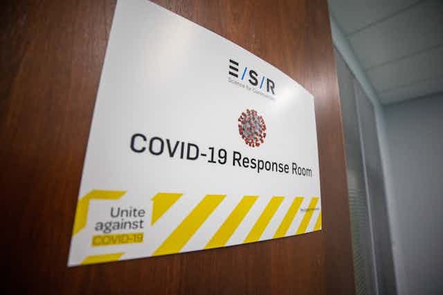 Sign on door saying 'COVID-19 response room'