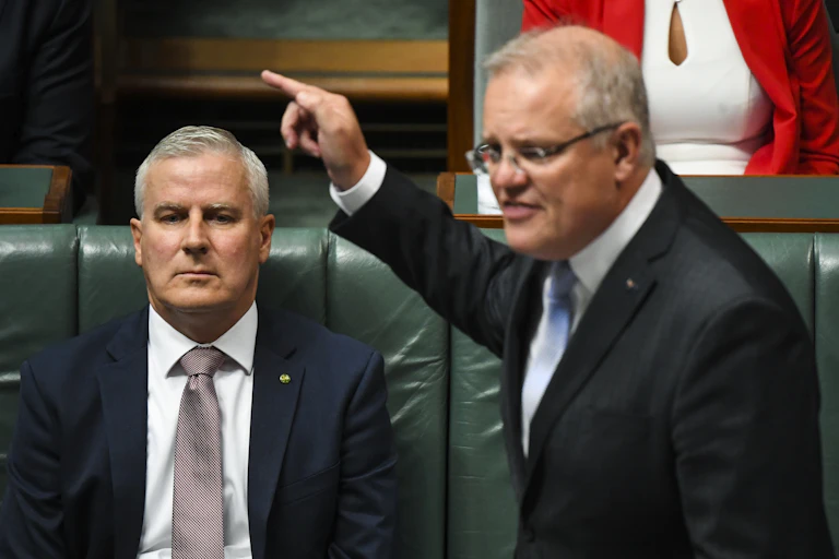 Michael McCormack, sitting behind Scott Morrison