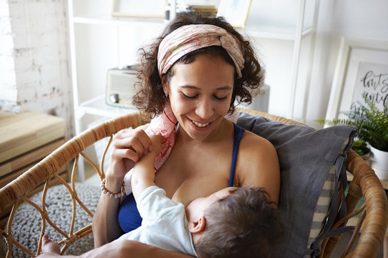 A woman breastfeeding a baby