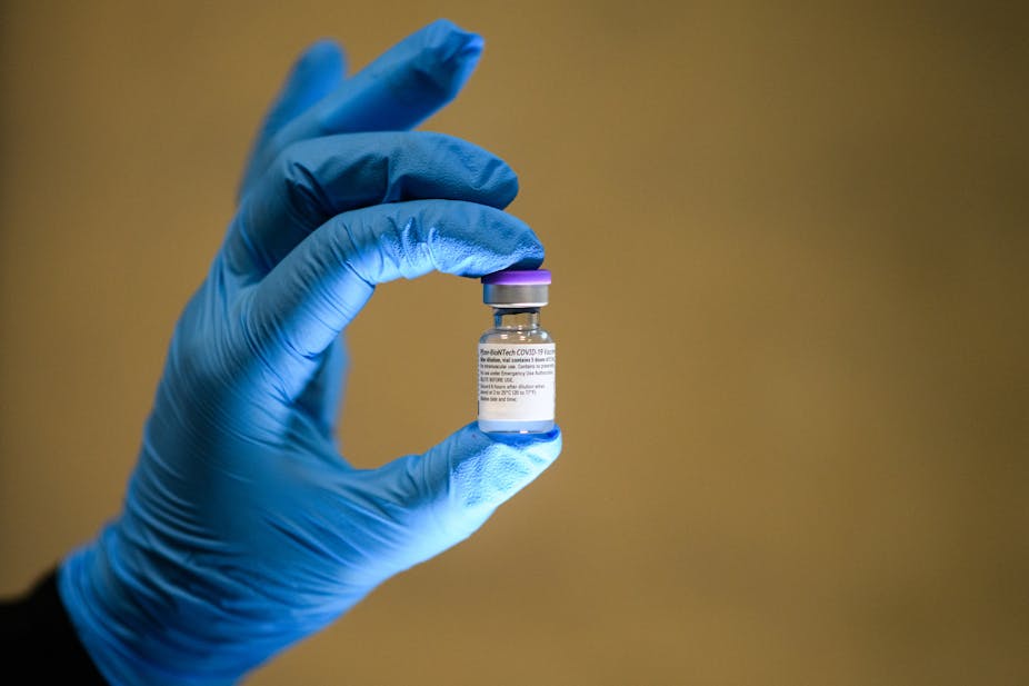 A vial of the Pfizer/BioNTech Covid-19 vaccine is seen during a vaccination clinic at the Sir Ludiwg Guttmann Health and Wellbeing Centre